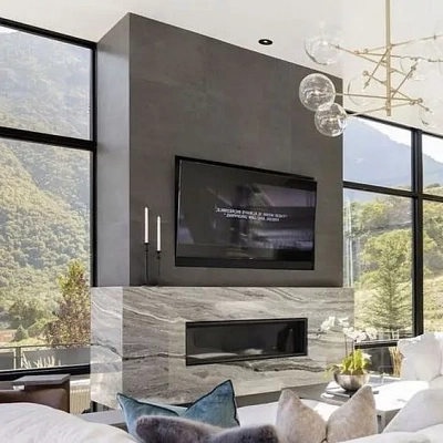 Отделка камина комбинированным керамогранитом под камень и бетон